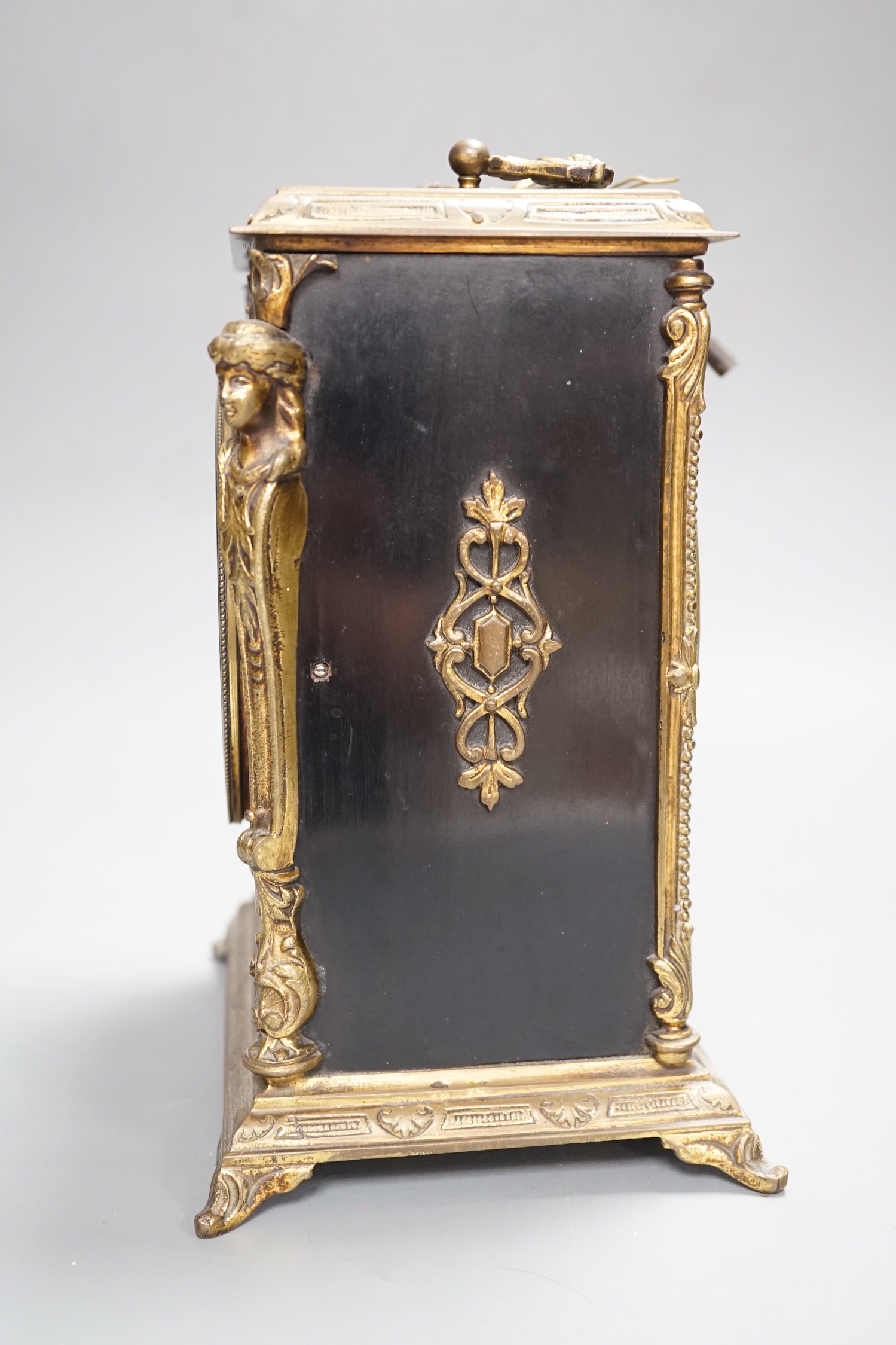 A 19th century brass and ebonised mantel clock
